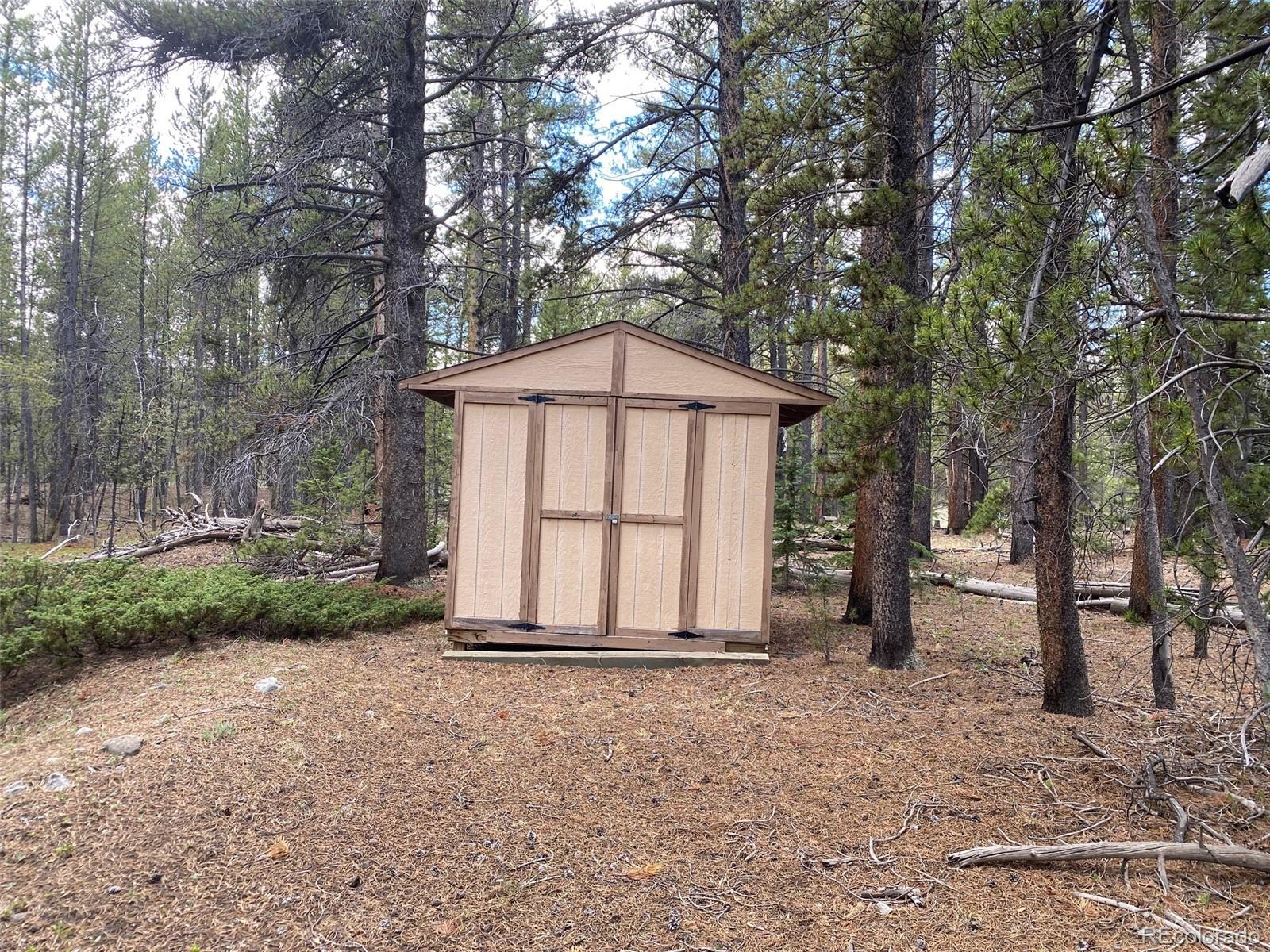 50 County Road Como, CO 80432 - Photo 19 of 25 a view of backyard with large tree and wooden fence