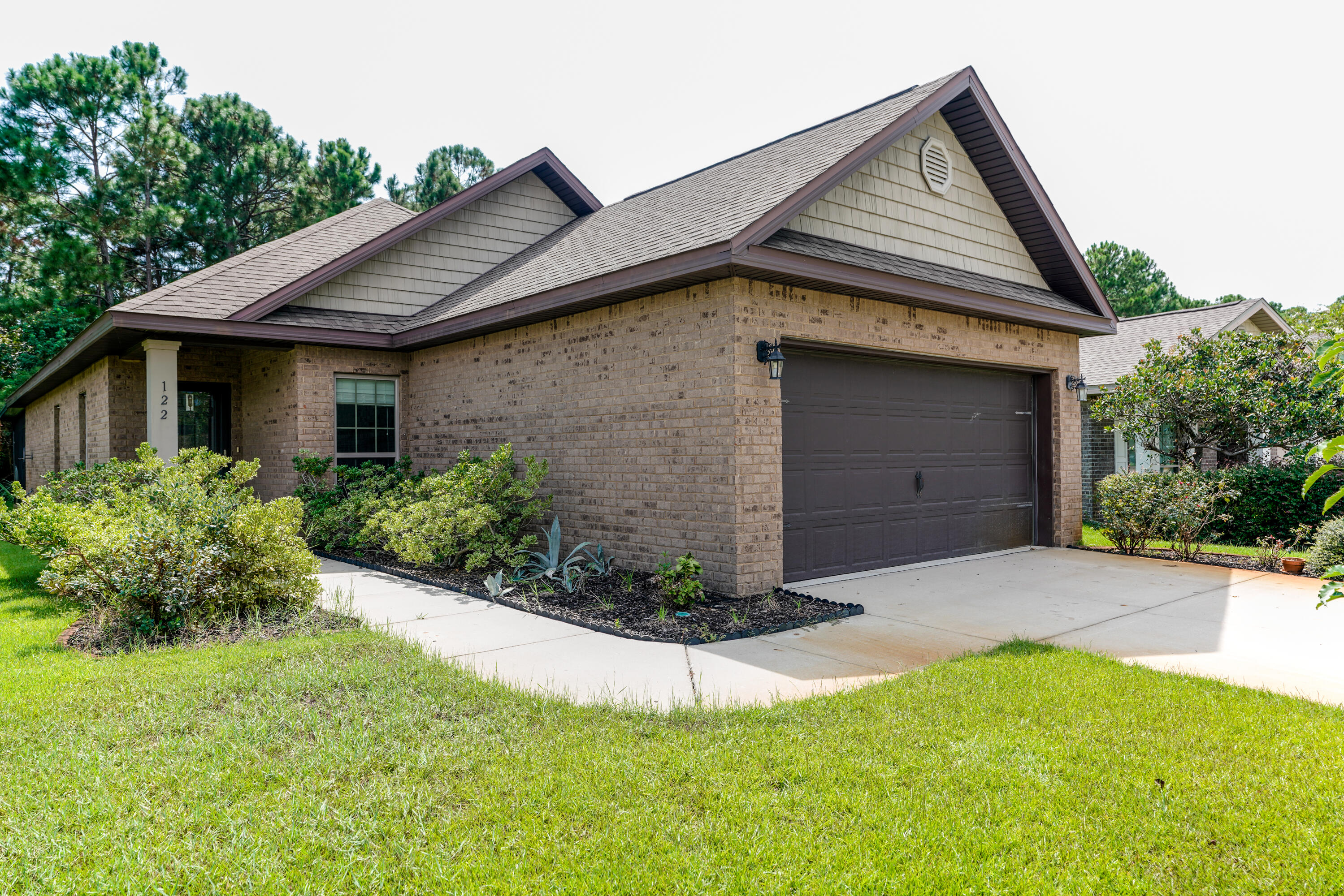 122 Riverbirch Loop Santa Rosa Beach, FL 32459 - Photo 1 of 41 a front view of a house with a yard and garage