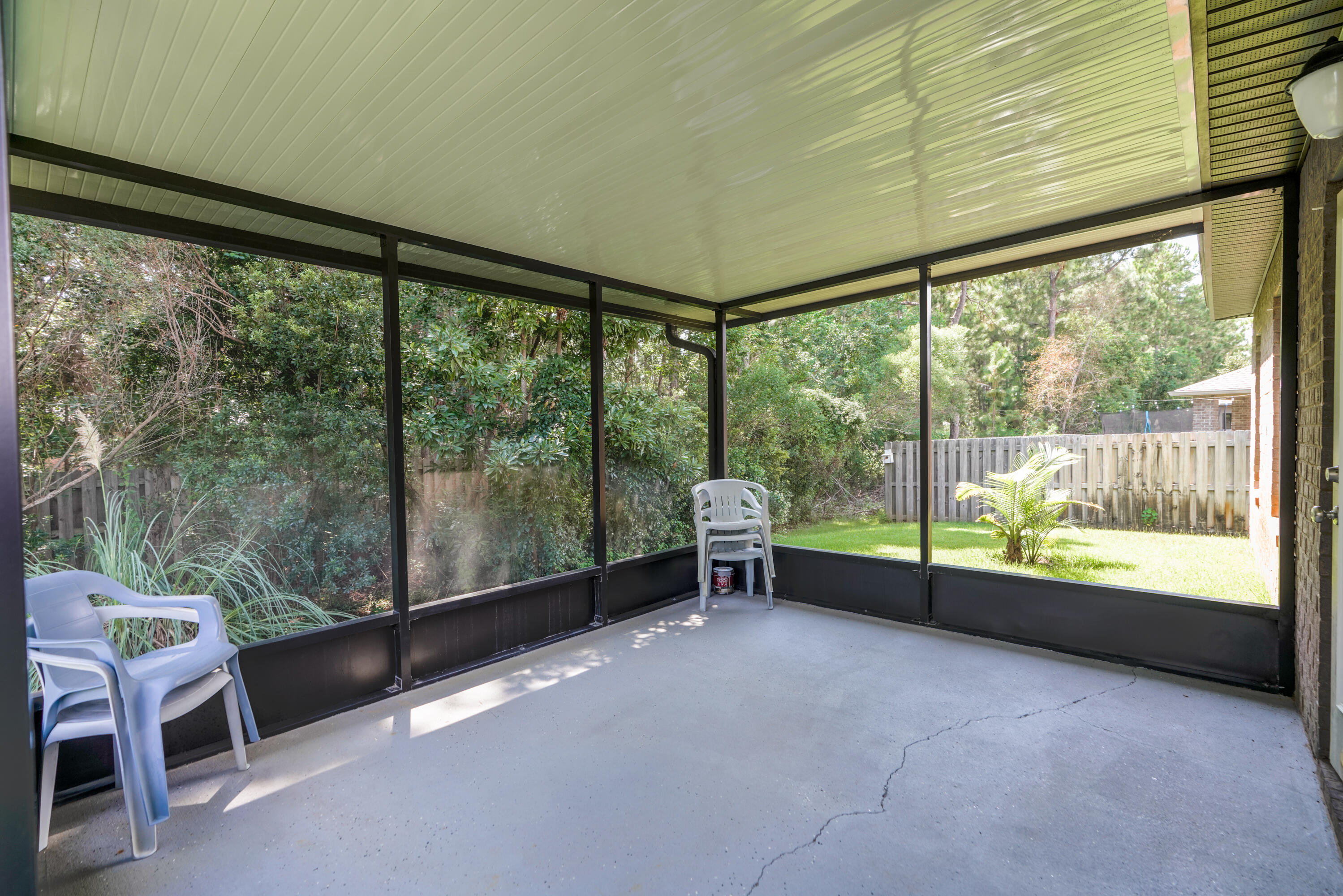 122 Riverbirch Loop Santa Rosa Beach, FL 32459 - Photo 12 of 41 a room with lawn chairs and a large window