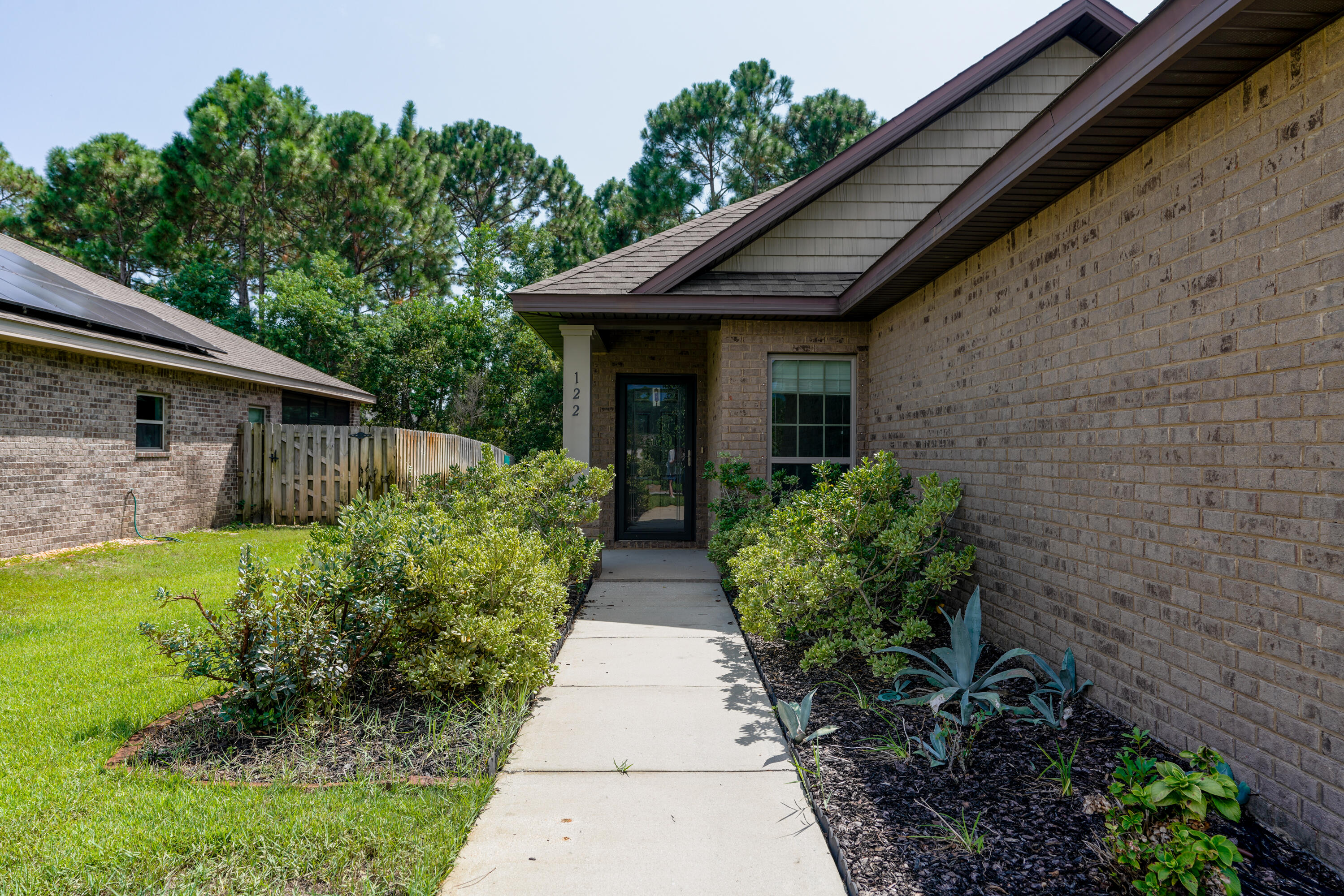 122 Riverbirch Loop Santa Rosa Beach, FL 32459 - Photo 2 of 41 a view of house with garden