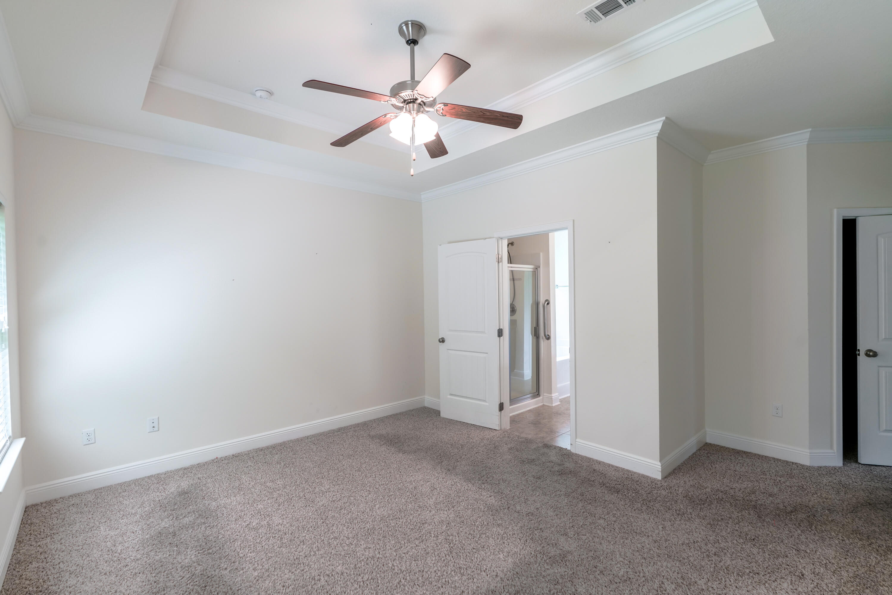 122 Riverbirch Loop Santa Rosa Beach, FL 32459 - Photo 27 of 41 a view of an empty room with a chandelier fan