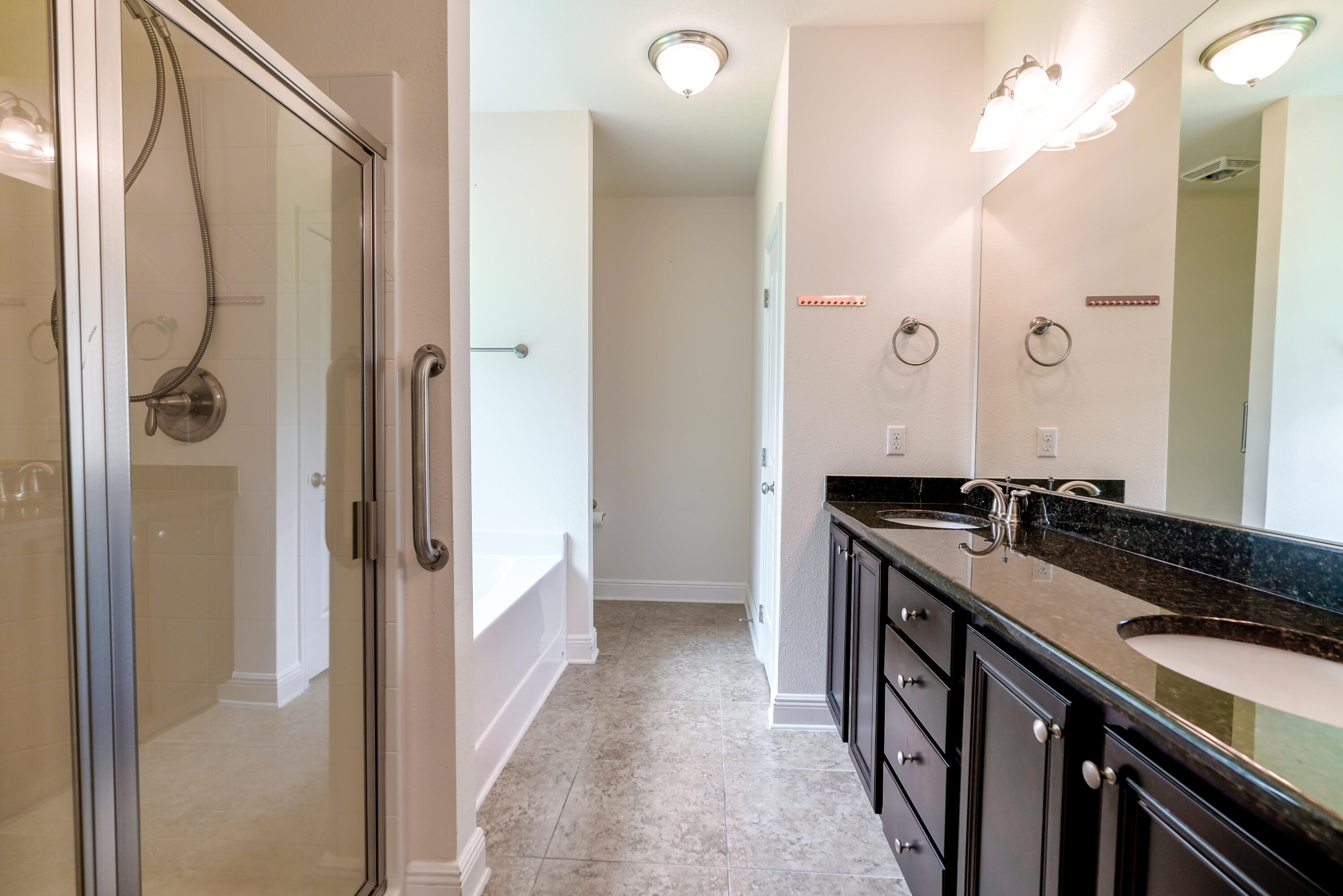 122 Riverbirch Loop Santa Rosa Beach, FL 32459 - Photo 29 of 41 a bathroom with a granite countertop sink a mirror and a shower