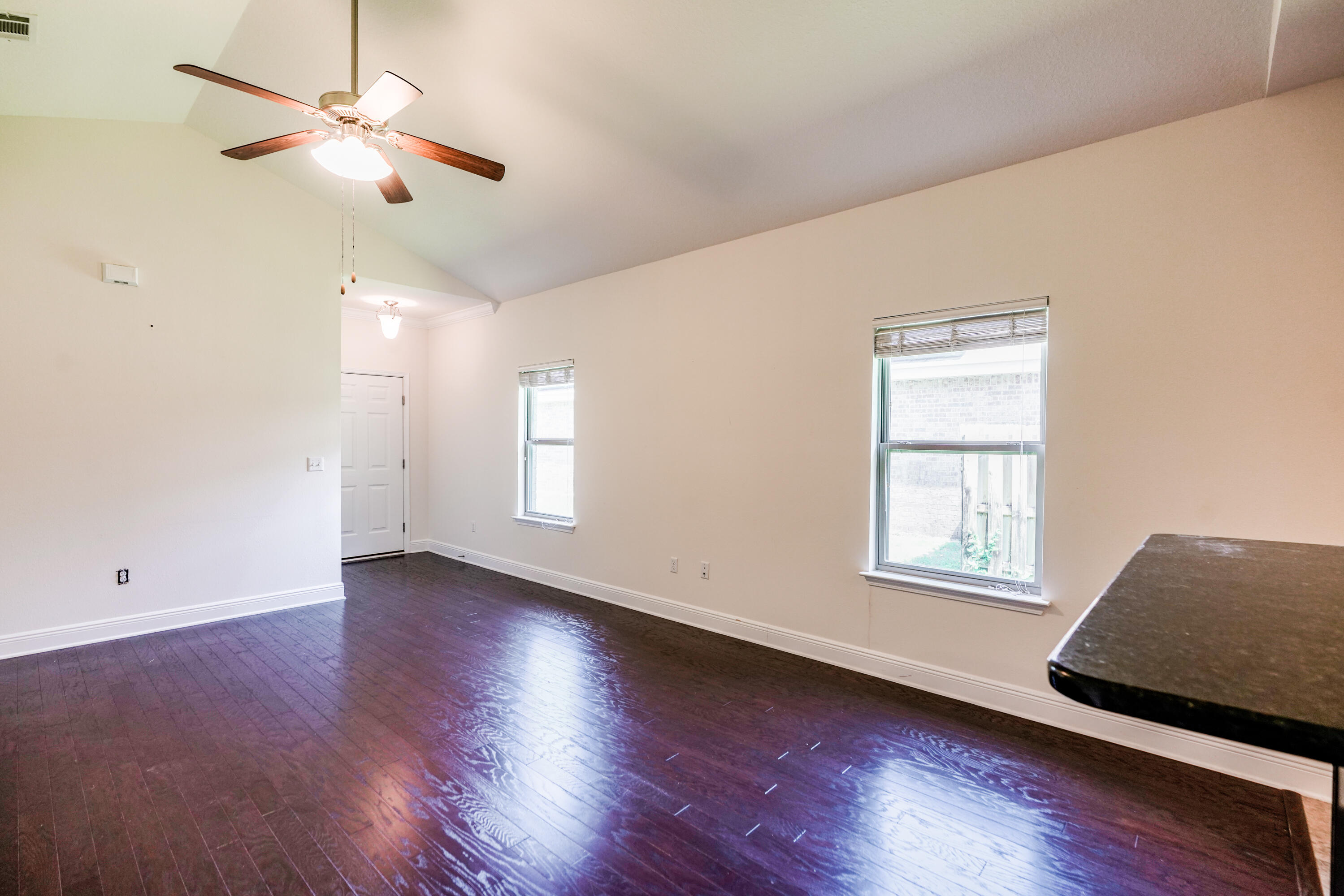 122 Riverbirch Loop Santa Rosa Beach, FL 32459 - Photo 6 of 41 a view of an empty room with a window and wooden floor