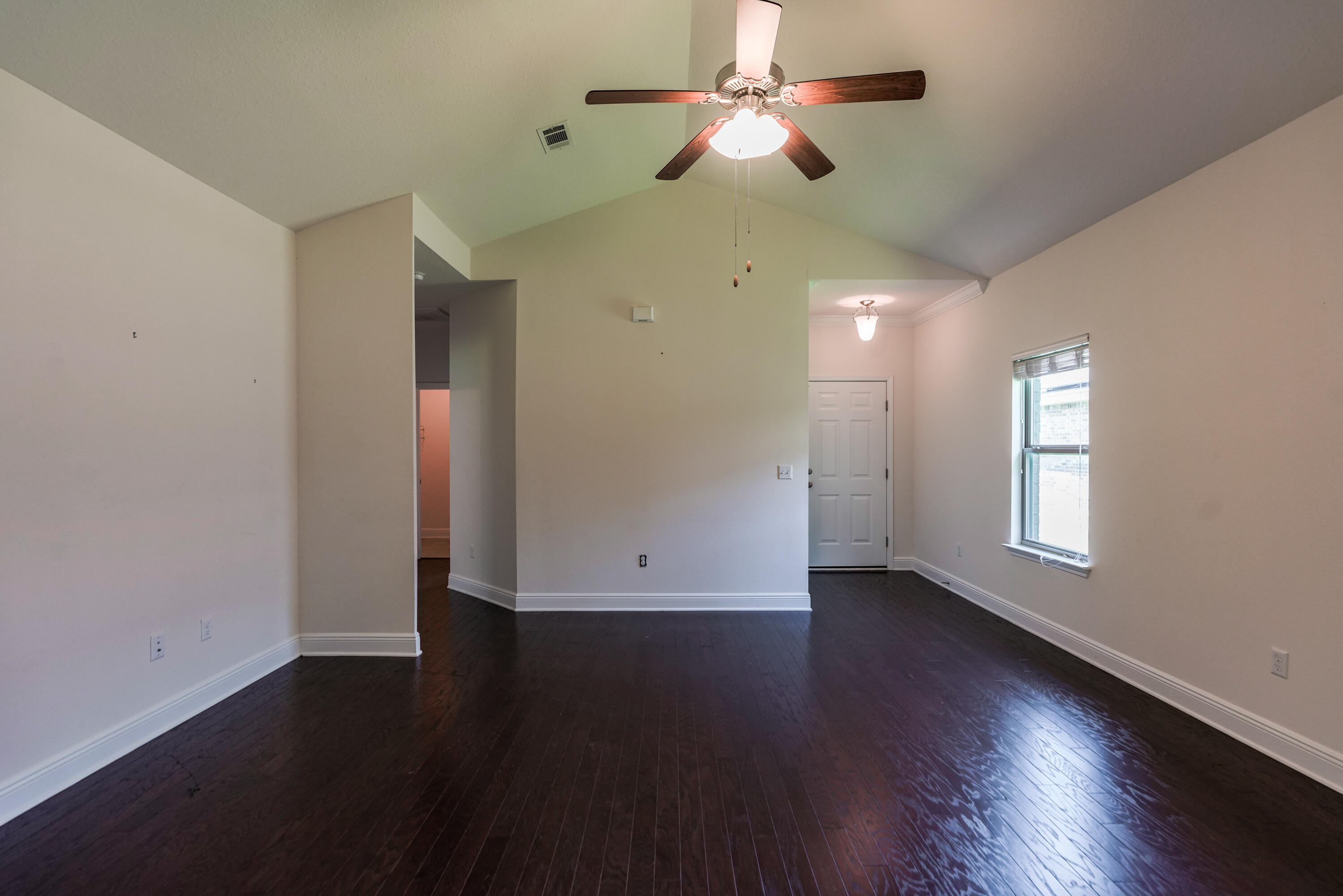 122 Riverbirch Loop Santa Rosa Beach, FL 32459 - Photo 7 of 41 a view of empty room with wooden floor and fan