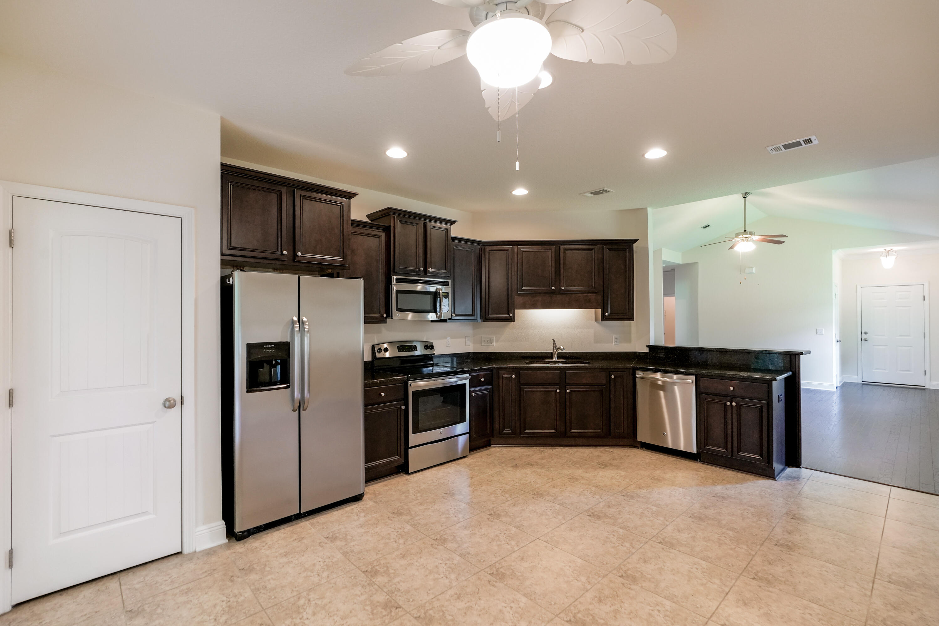 122 Riverbirch Loop Santa Rosa Beach, FL 32459 - Photo 10 of 41 a large kitchen with cabinets and stainless steel appliances