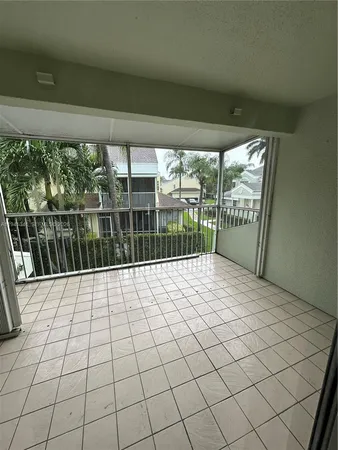a view of empty room with balcony