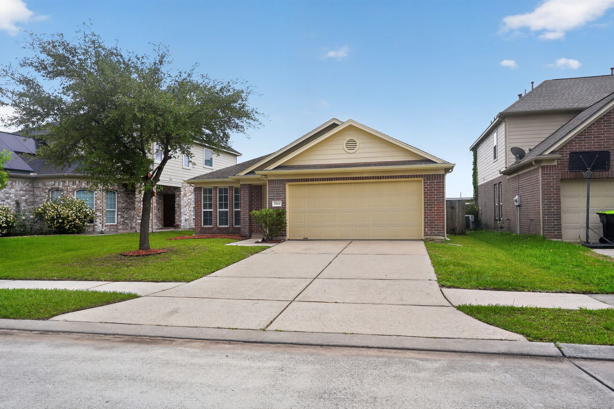 29414 Winton Wood Way Spring, TX 77386 - Photo 4 of 35 a front view of a house with a yard and garage