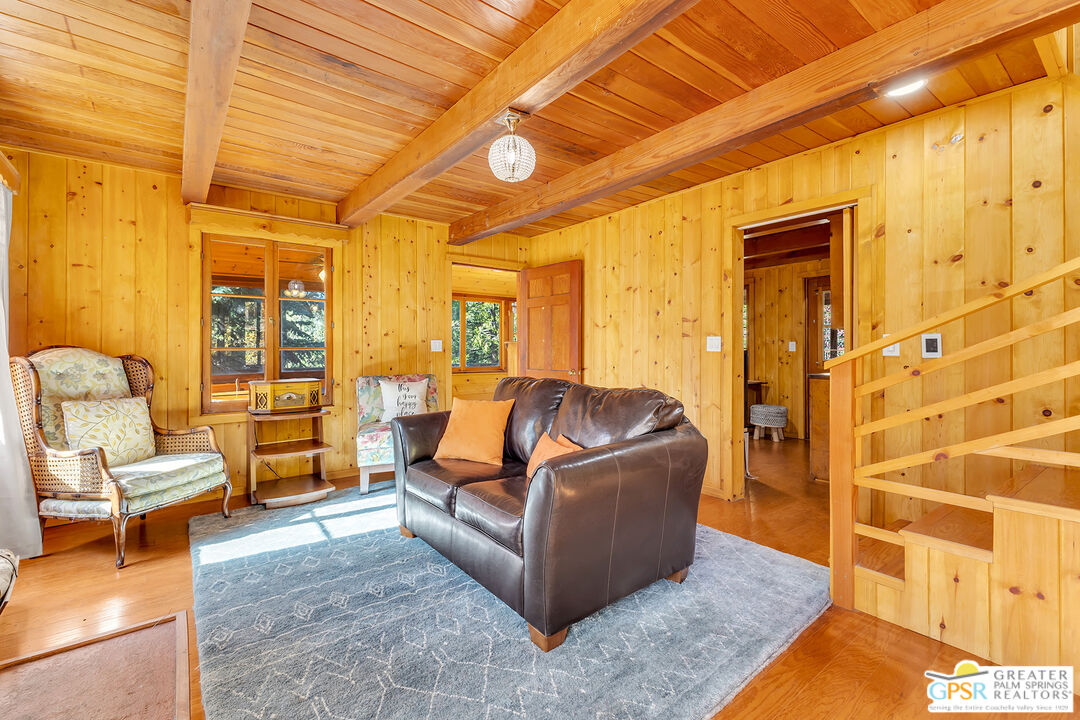 25250 Rim Rock Road Idyllwild, CA 92549 - Photo 26 of 72 a living room with furniture and a rug
