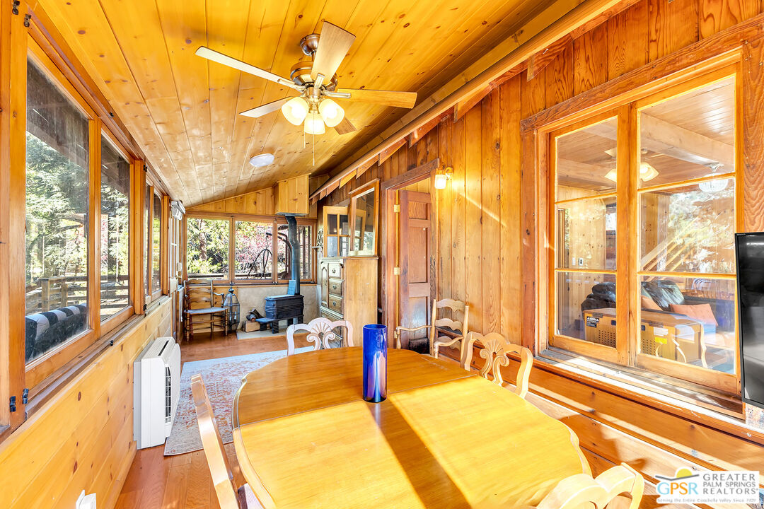 25250 Rim Rock Road Idyllwild, CA 92549 - Photo 34 of 72 a living room with large windows