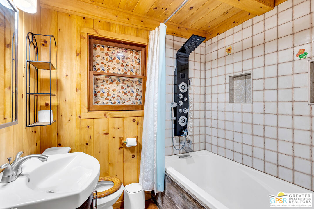 25250 Rim Rock Road Idyllwild, CA 92549 - Photo 36 of 72 a bathroom with a sink and a bathtub