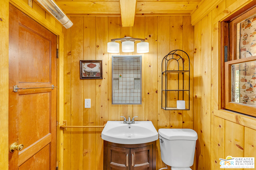25250 Rim Rock Road Idyllwild, CA 92549 - Photo 38 of 72 a bathroom with a sink a toilet and shower