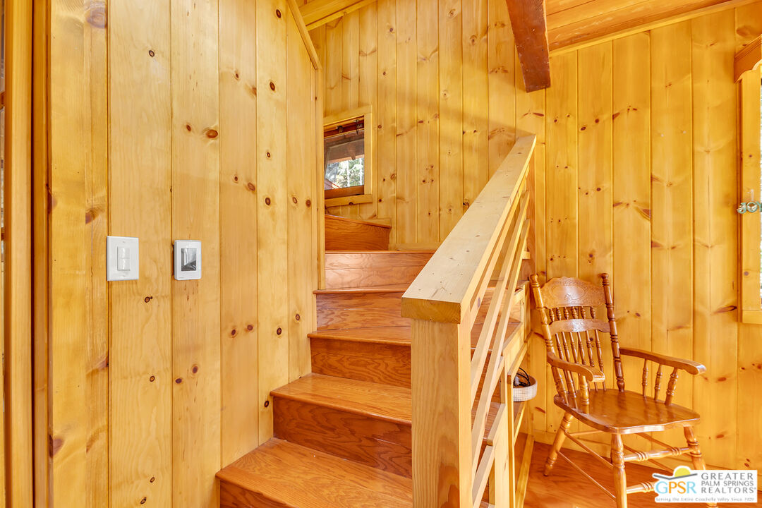 25250 Rim Rock Road Idyllwild, CA 92549 - Photo 39 of 72 a view of a bathroom with a shower curtain