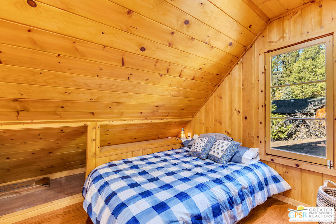 25250 Rim Rock Road Idyllwild, CA 92549 - Photo 41 of 72 a bedroom with a bed and a window