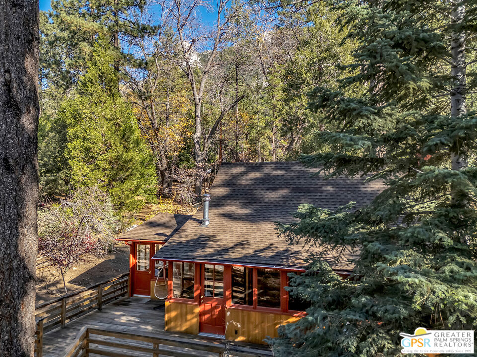 25250 Rim Rock Road Idyllwild, CA 92549 - Photo 7 of 72 an aerial view of a house with large trees