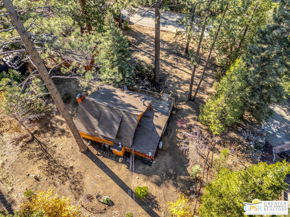 25250 Rim Rock Road Idyllwild, CA 92549 - Photo 9 of 72 a view of a bench in a backyard
