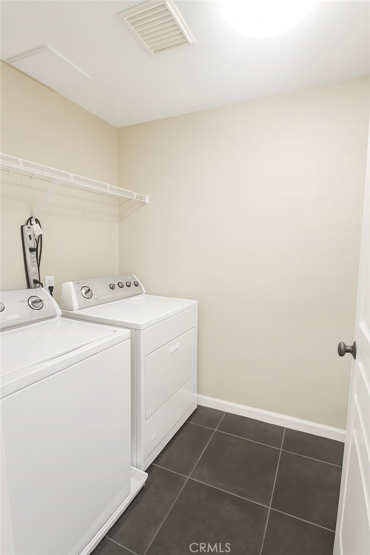 8045 Torino Stanton, CA 90680 - Photo 19 of 21 a utility room with dryer and washer