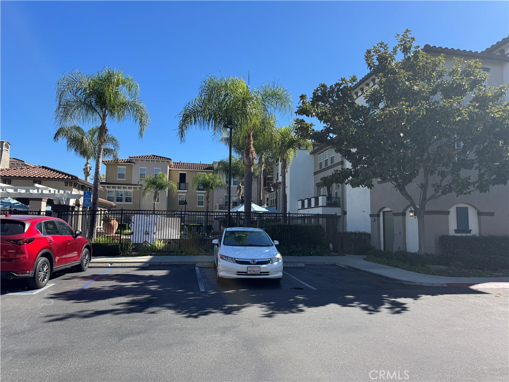 8045 Torino Stanton, CA 90680 - Photo 2 of 21 a car parked in front of a building