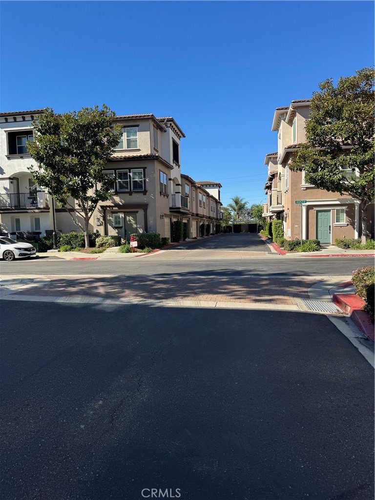 8045 Torino Stanton, CA 90680 - Photo 3 of 21 a front view of a building with streets and trees