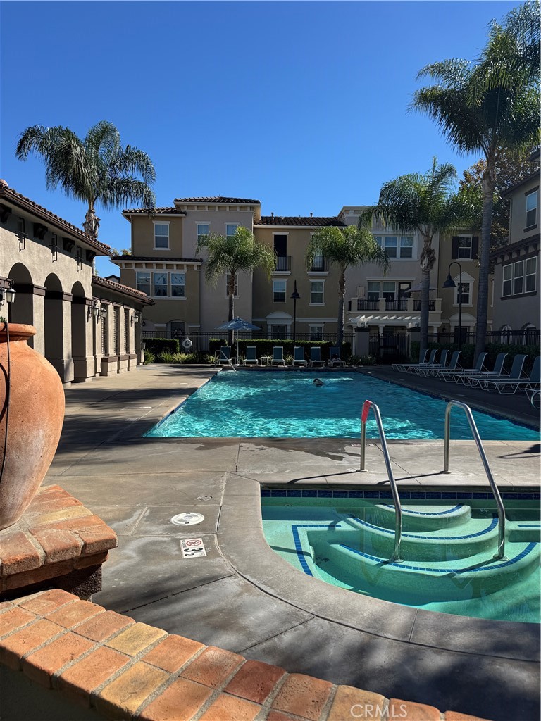 8045 Torino Stanton, CA 90680 - Photo 5 of 21 a view of a house with swimming pool and a yard