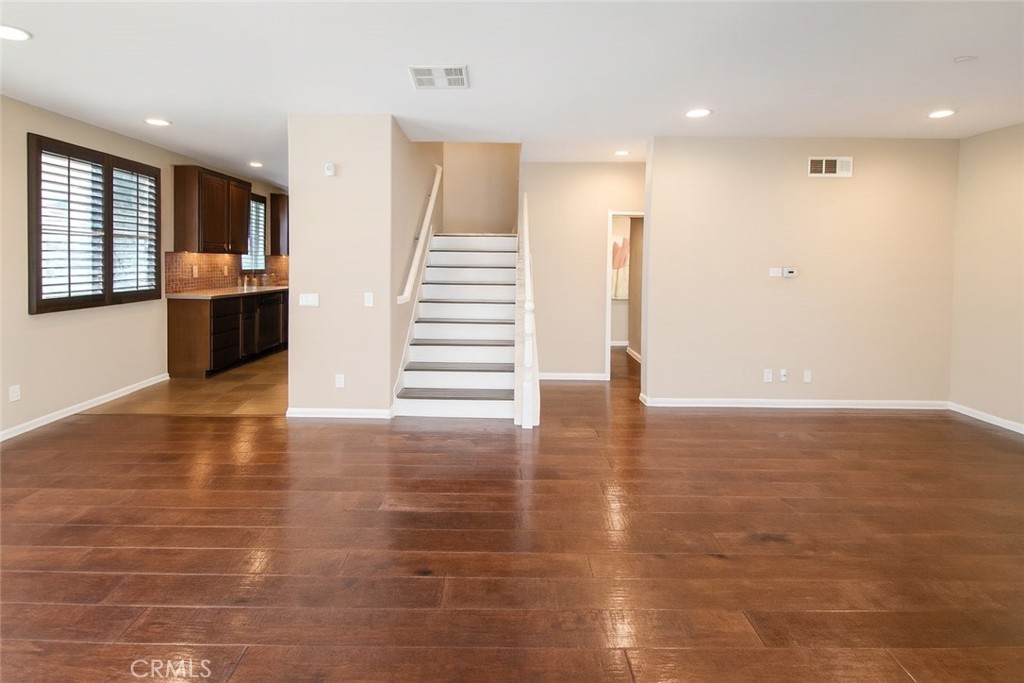 8045 Torino Stanton, CA 90680 - Photo 10 of 21 a view of a living room with hard wood flooring