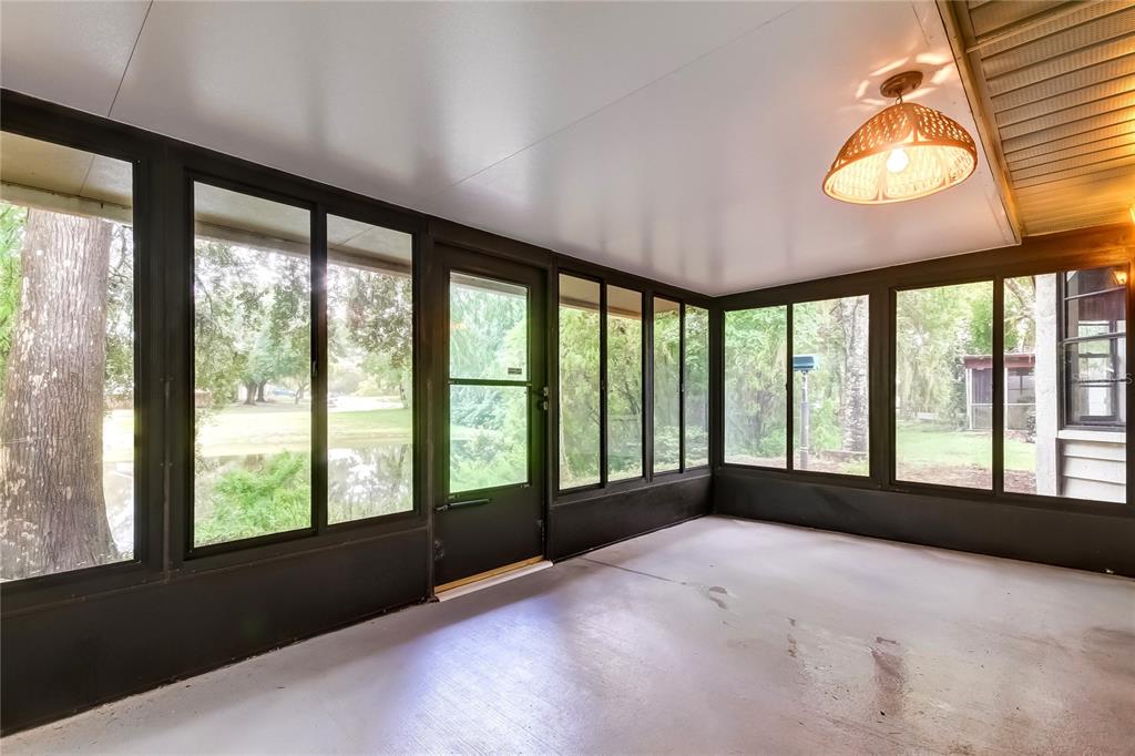 7438 Sheldrake Street New Port Richey, FL 34654 - Photo 25 of 29 FLORIDA ROOM WITH PLEXI GLASS WINDOWS