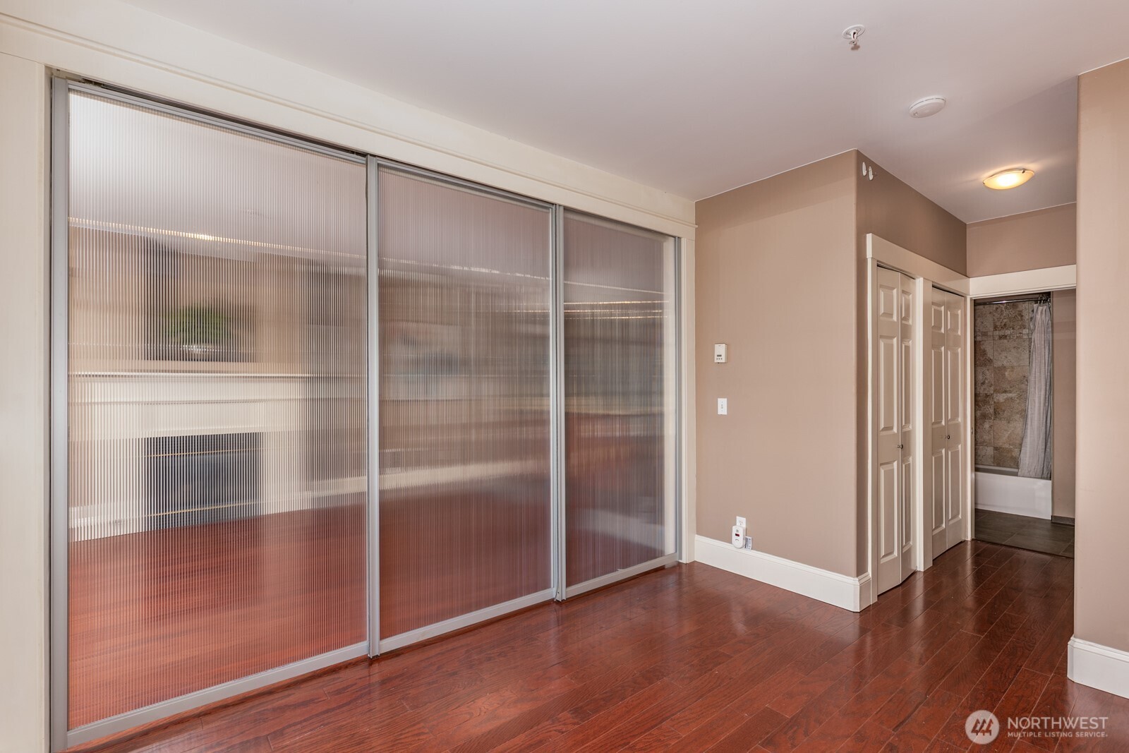 3221 Southwest Avalon Way, Unit 201 Seattle, WA 98126 - Photo 19 of 39 a view of a hallway with wooden floor