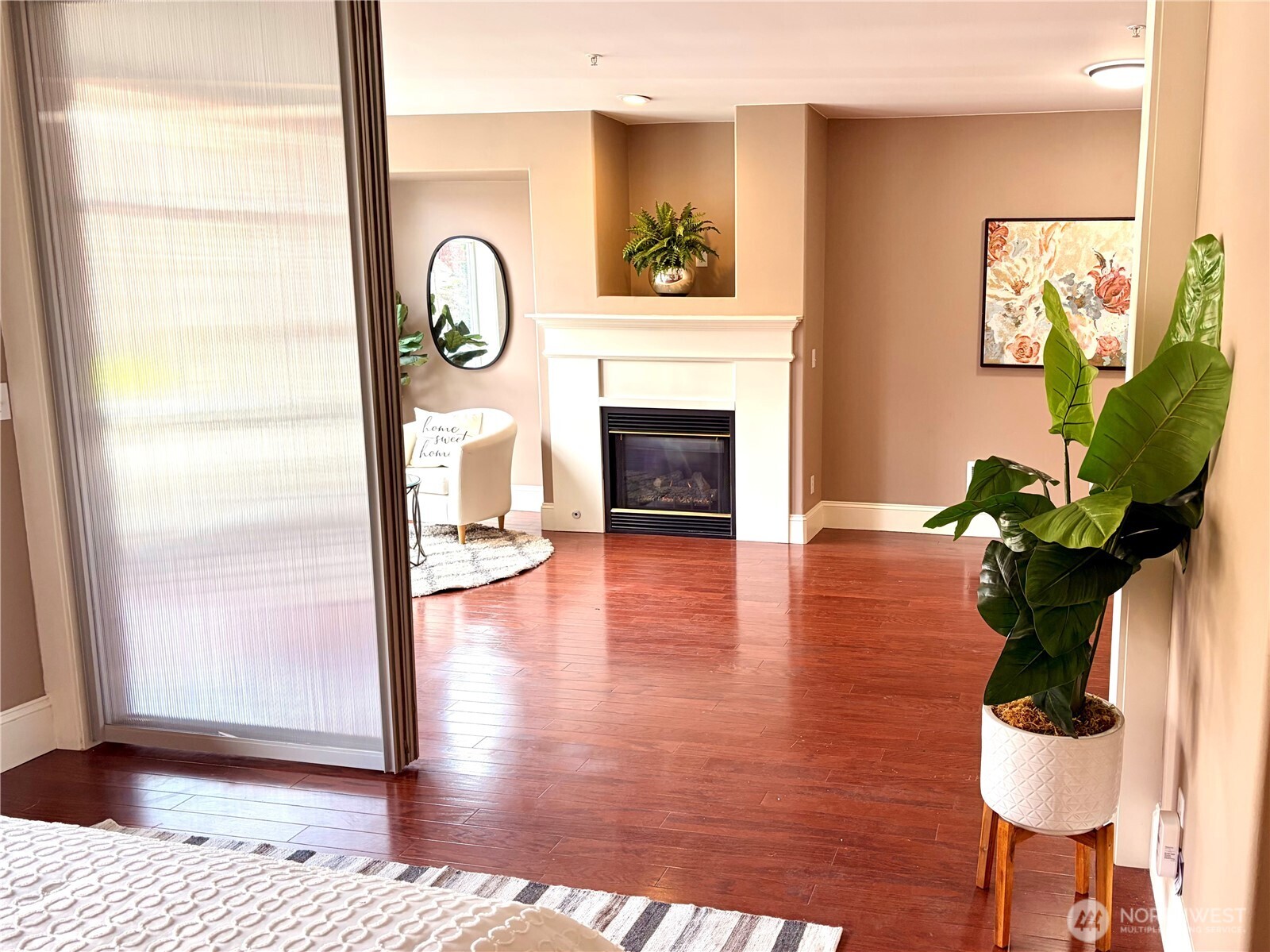 3221 Southwest Avalon Way, Unit 201 Seattle, WA 98126 - Photo 20 of 39 a living room with furniture a fireplace and wooden floor