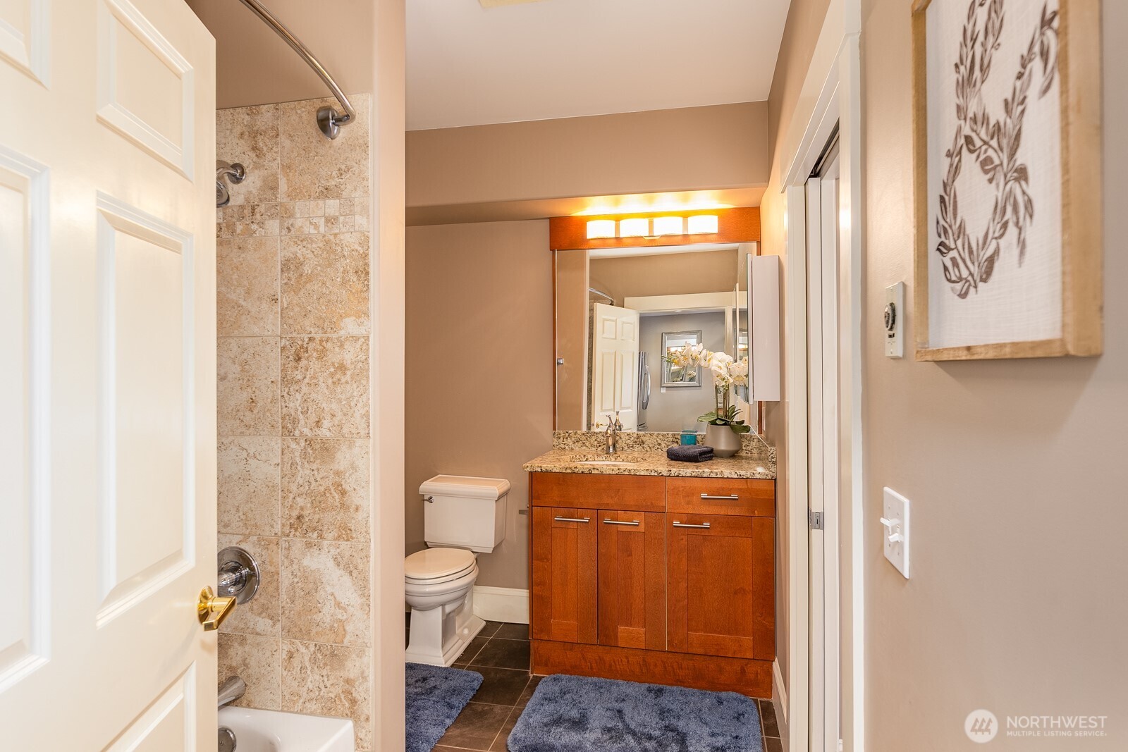 3221 Southwest Avalon Way, Unit 201 Seattle, WA 98126 - Photo 24 of 39 a bathroom with a sink a toilet and shower