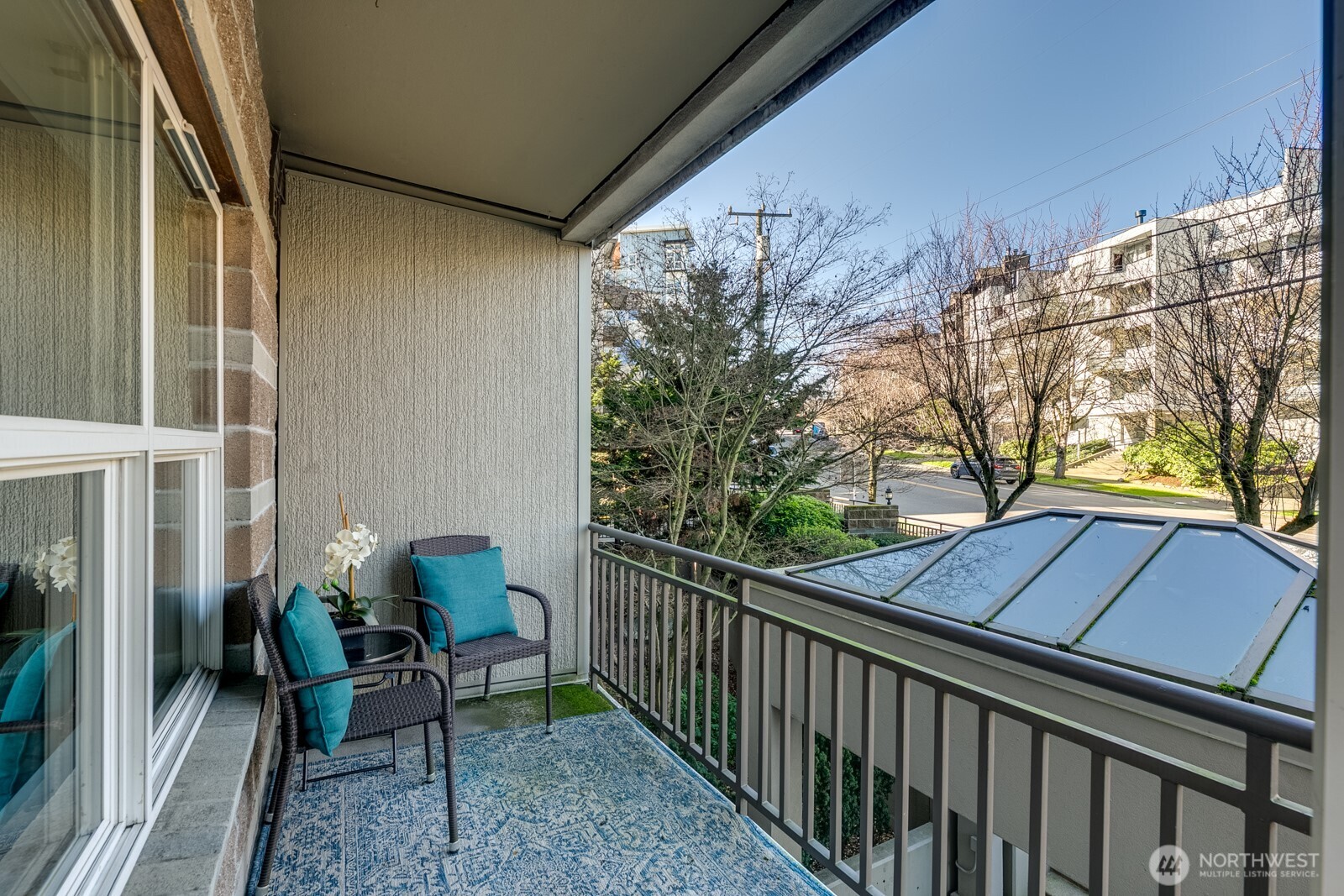 3221 Southwest Avalon Way, Unit 201 Seattle, WA 98126 - Photo 26 of 39 a view of two chairs in the balcony