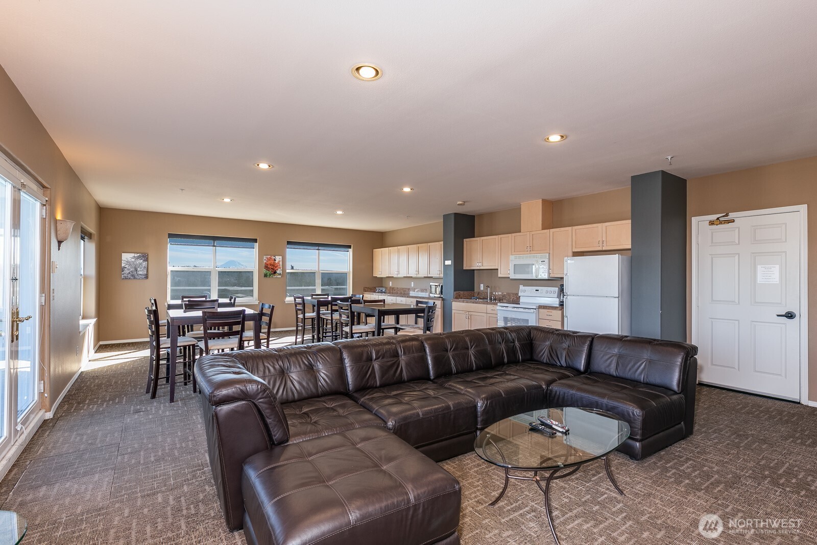 3221 Southwest Avalon Way, Unit 201 Seattle, WA 98126 - Photo 32 of 39 a living room with furniture kitchen and a table