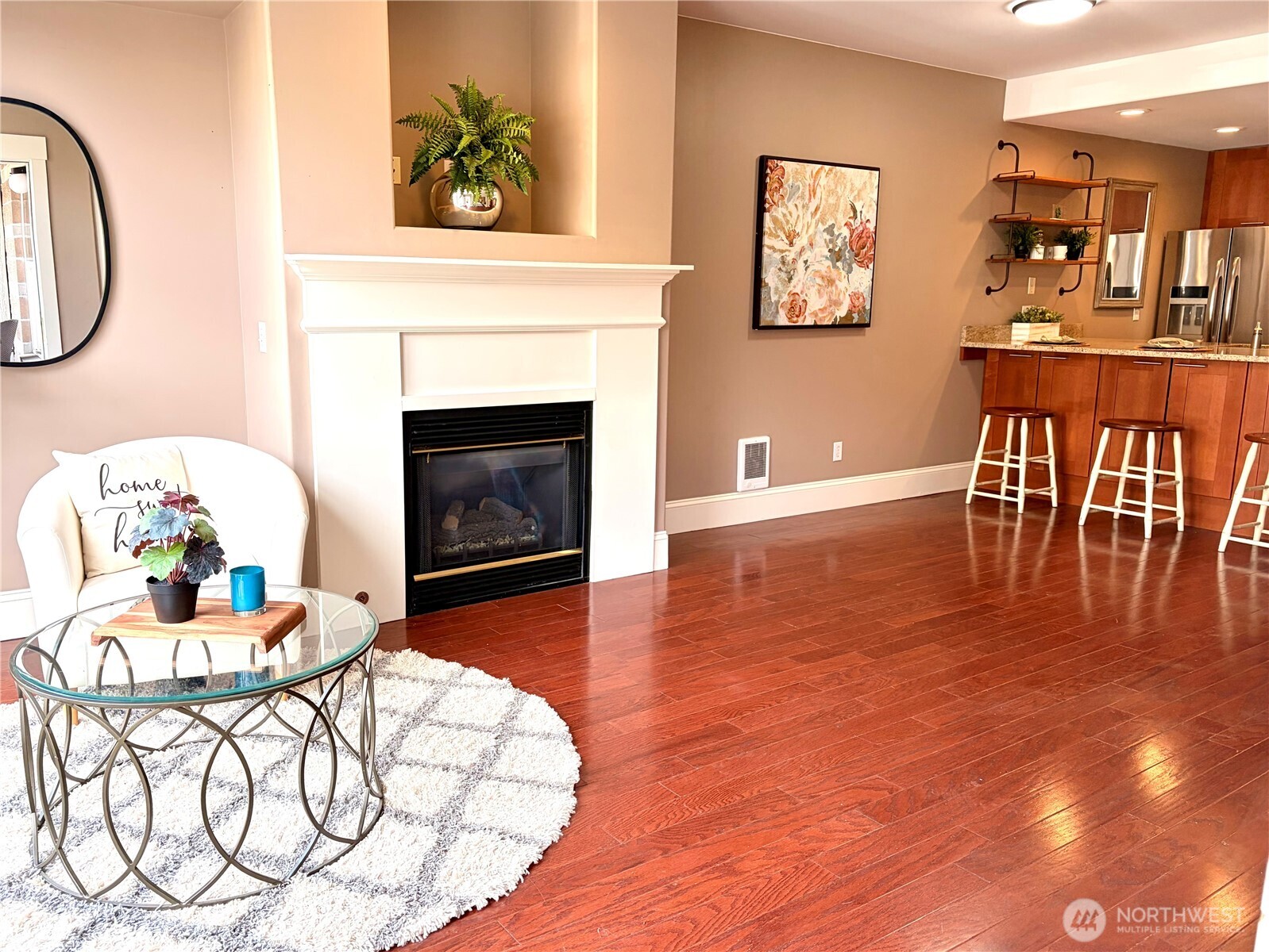 3221 Southwest Avalon Way, Unit 201 Seattle, WA 98126 - Photo 10 of 39 a living room with furniture and a fireplace