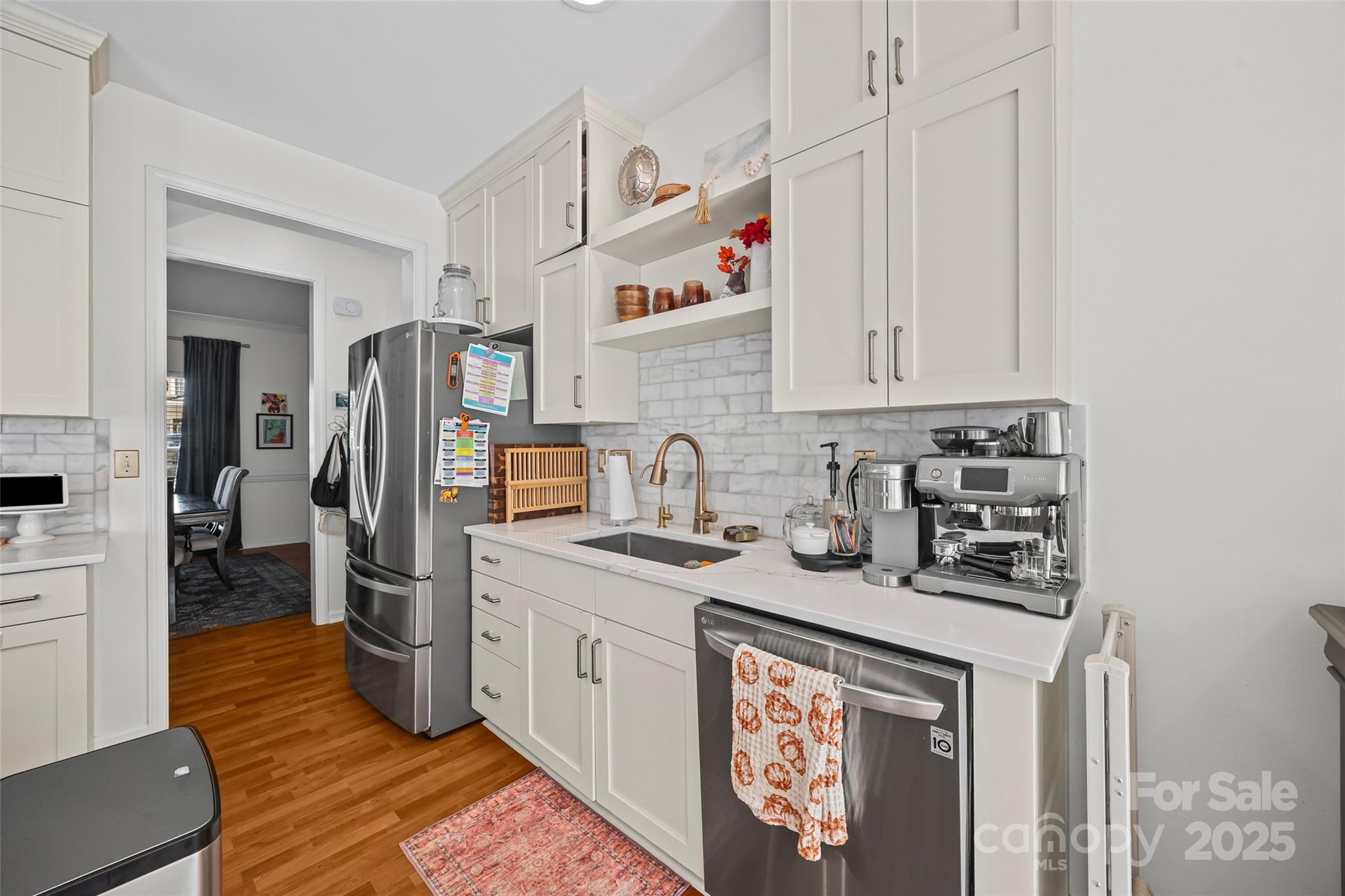 543 St George Road Fort Mill, SC 29708 - Photo 13 of 42 a kitchen with stainless steel appliances granite countertop a sink stove and refrigerator