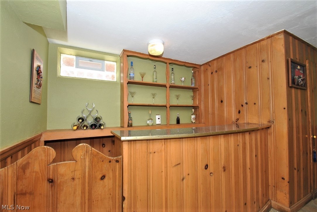 2328 Traymore Road Cleveland, OH 44118 - Photo 18 of 25 Original Pine paneling & shelving in closeup view of wet bar in LL family room