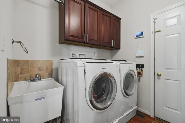 a utility room with dryer and washer