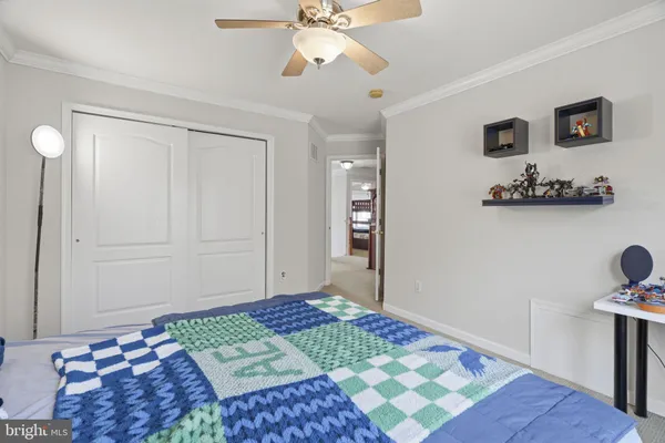 a bedroom with a bed and cabinets