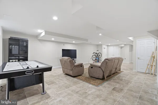 a living room with furniture and a table