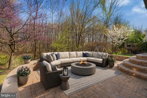 a view of a patio with couches and chairs