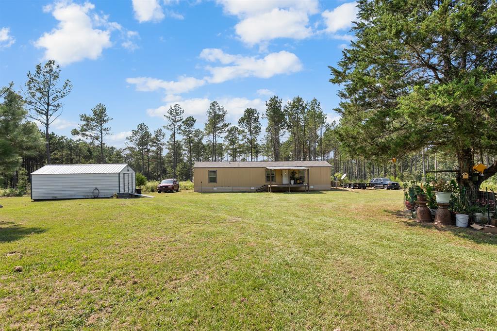 6446 Farm To Market Road 752 Rusk, TX 75785 - Photo 12 of 40 a house with a field