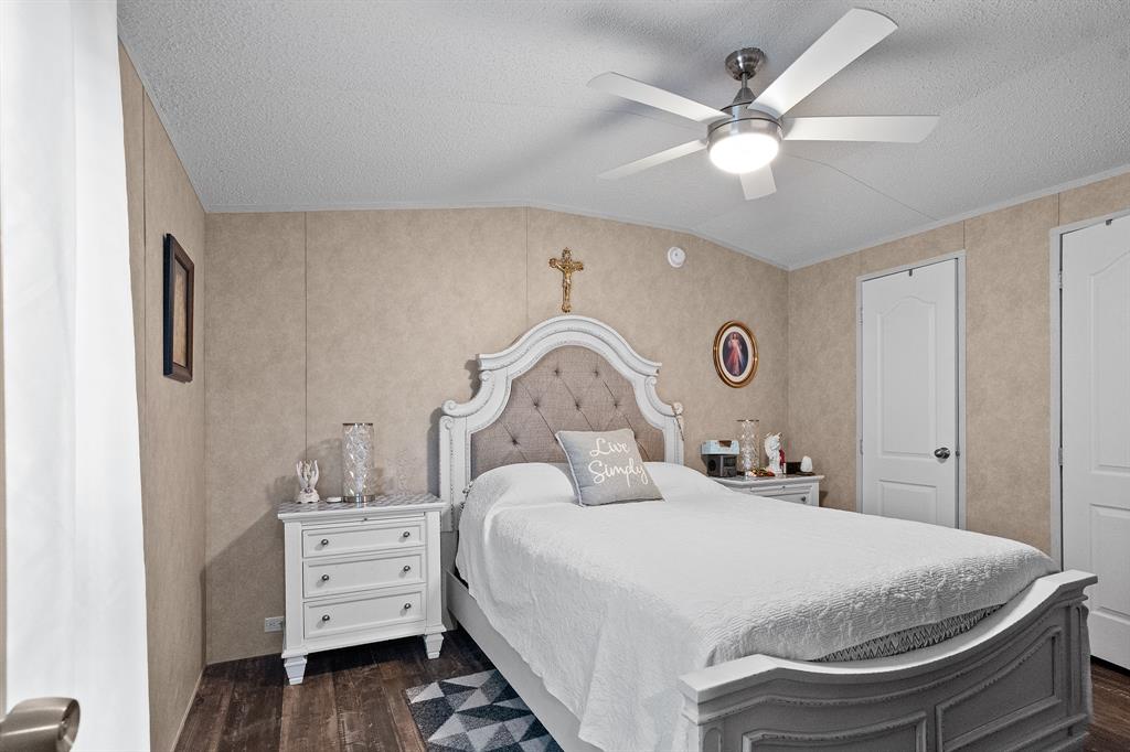 6446 Farm To Market Road 752 Rusk, TX 75785 - Photo 13 of 40 a bedroom with a bed and a chandelier