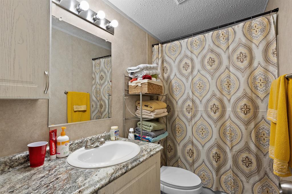 6446 Farm To Market Road 752 Rusk, TX 75785 - Photo 14 of 40 a bathroom with a sink toilet and shower