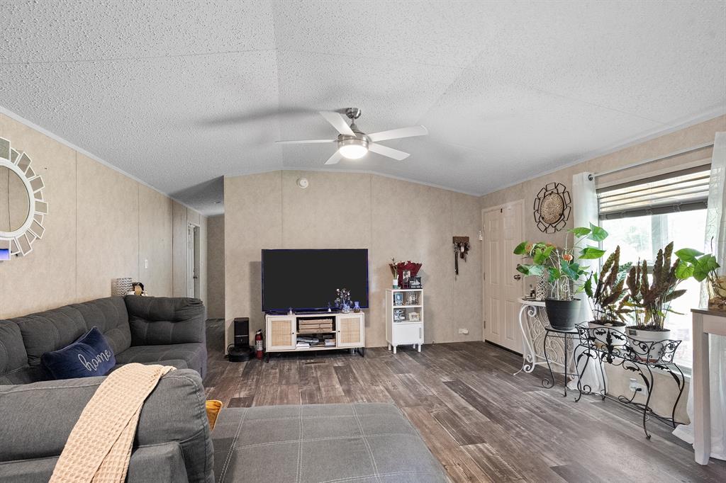 6446 Farm To Market Road 752 Rusk, TX 75785 - Photo 16 of 40 a living room with furniture and a flat screen tv