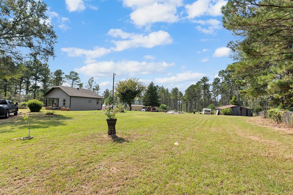 6446 Farm To Market Road 752 Rusk, TX 75785 - Photo 18 of 40 a house view with swimming pool in front of the house