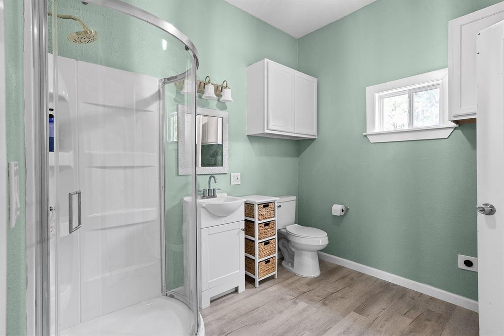 6446 Farm To Market Road 752 Rusk, TX 75785 - Photo 4 of 40 a bathroom with a toilet and a shower