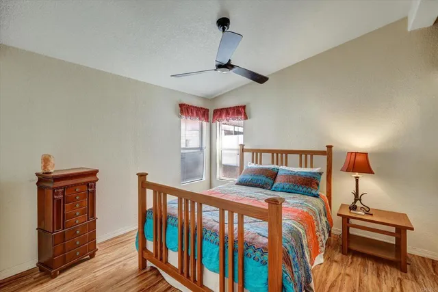 a bedroom with furniture and a window