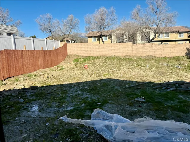 a view of a backyard with a garden