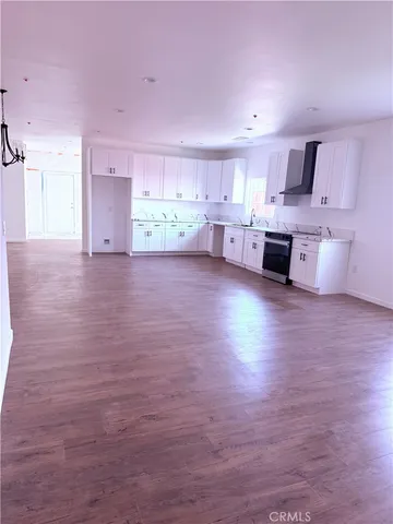 a kitchen with a sink cabinets and window