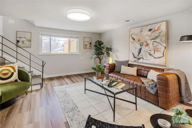 a front view of a house with a large window