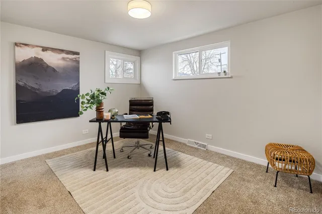 a front view of a house with a garden and bathtub