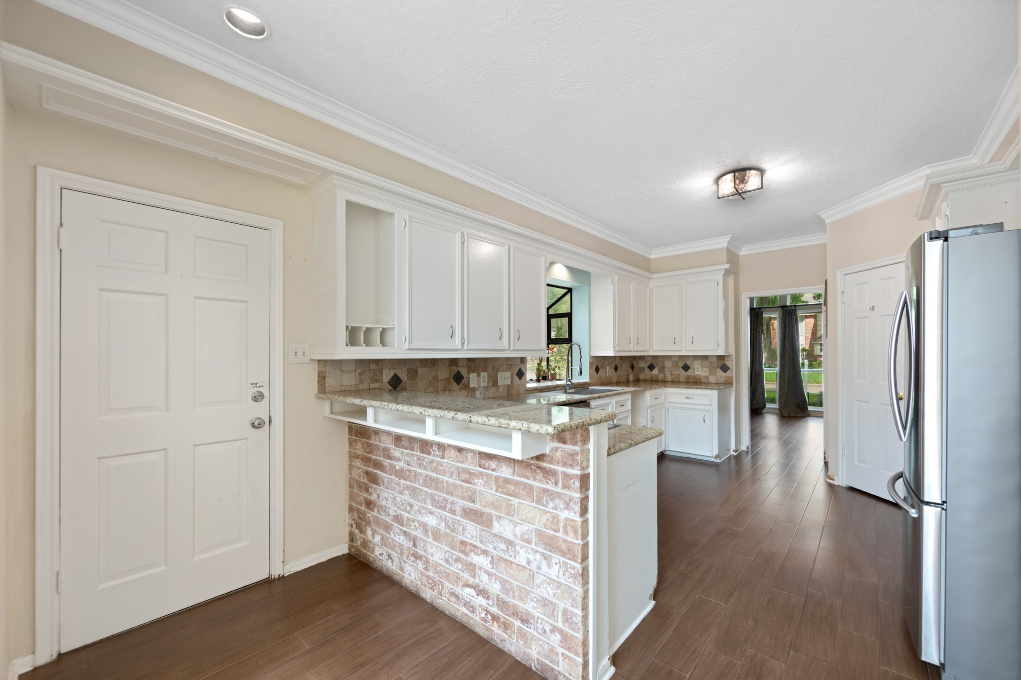 5115 Westerham Place Houston, TX 77069 - Photo 12 of 50 a kitchen with stainless steel appliances granite countertop a refrigerator and a stove top oven