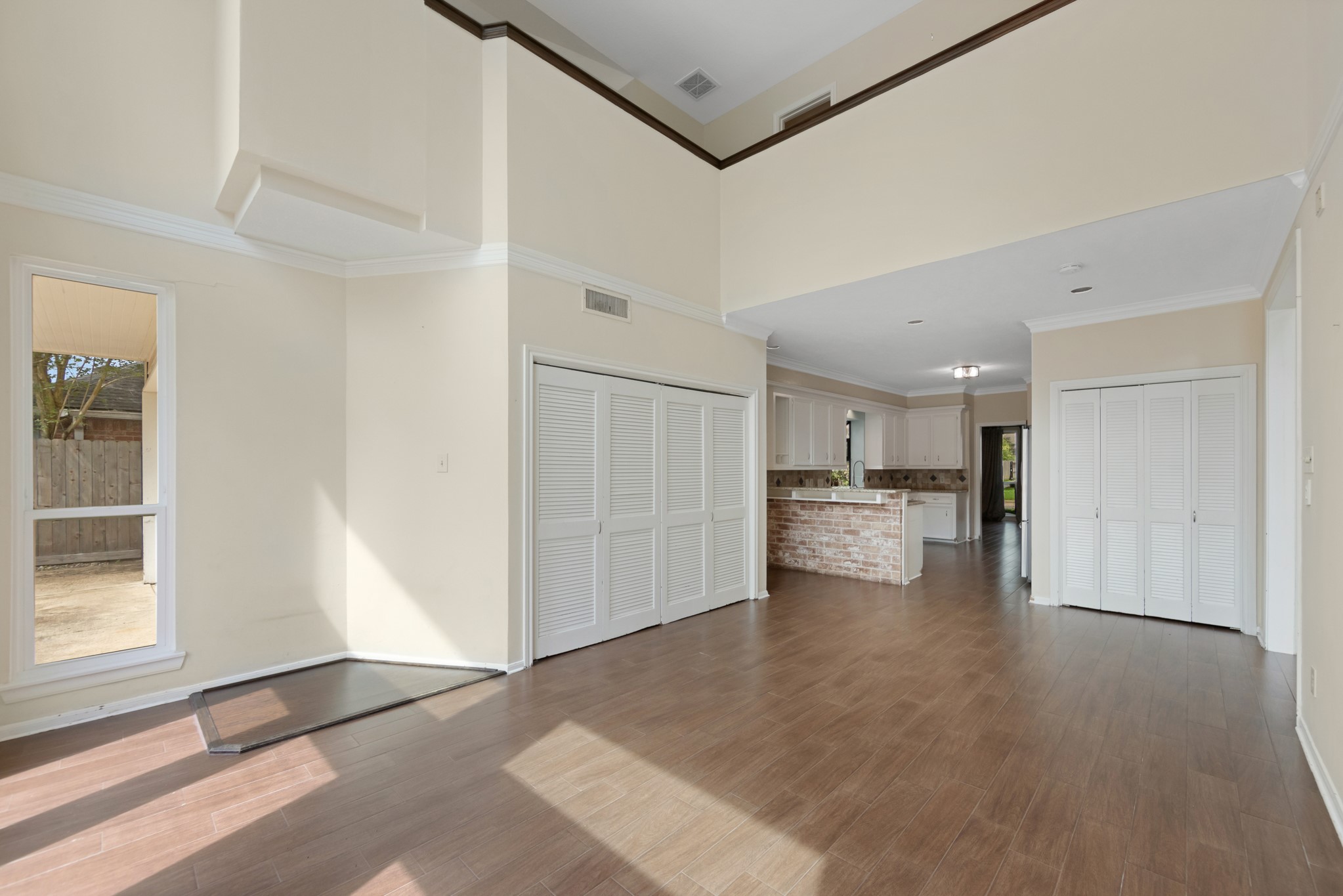 5115 Westerham Place Houston, TX 77069 - Photo 15 of 50 a view of a kitchen with wooden floor and windows